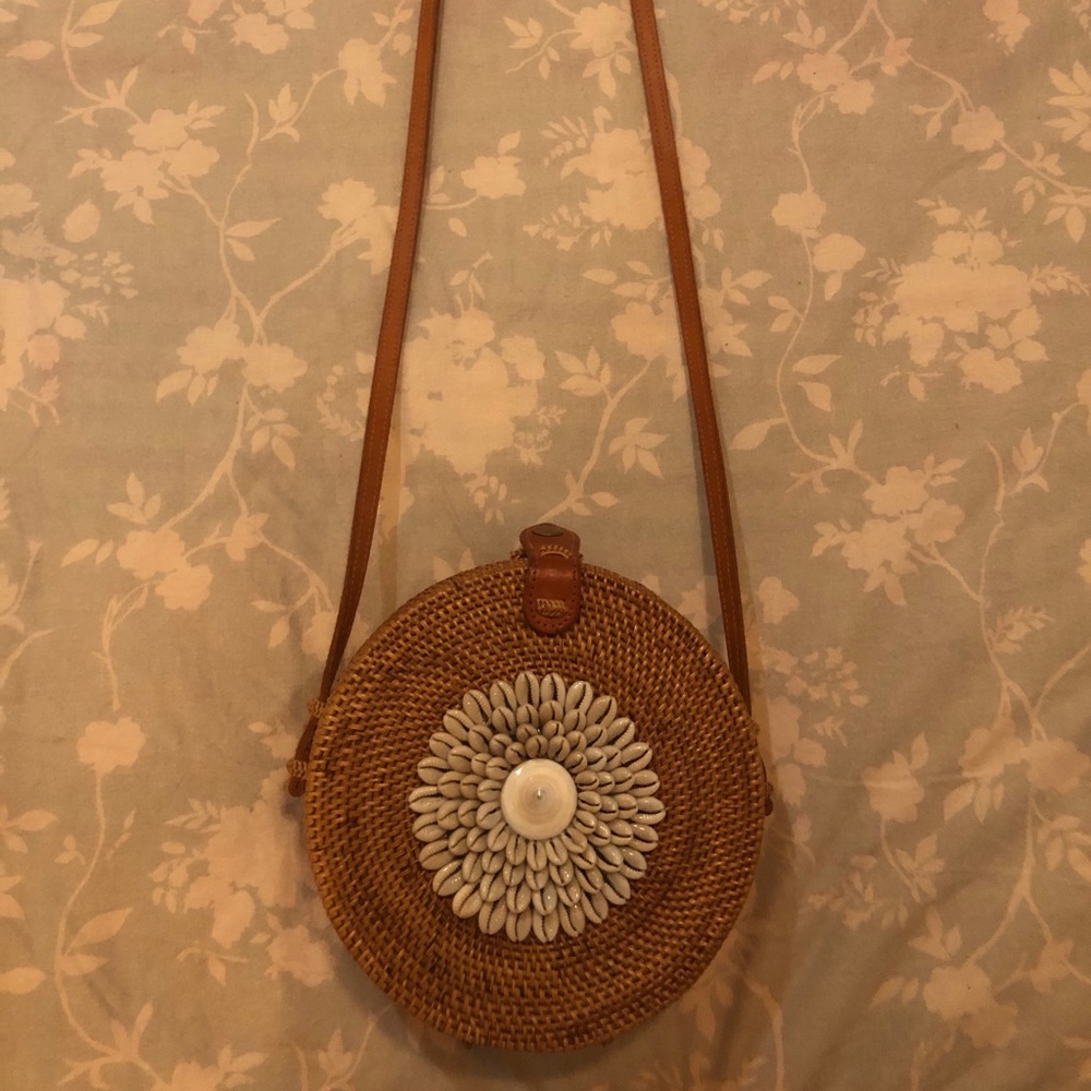 Shell embroidered woven purse.